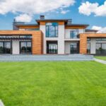 Neighborhood - Exterior of modern house with glass doors and panoramic windows