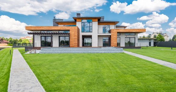 Neighborhood - Exterior of modern house with glass doors and panoramic windows