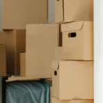 New Home - Brown Cardboard Boxes on White Wooden Drawer