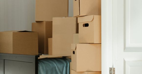 New Home - Brown Cardboard Boxes on White Wooden Drawer