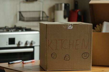 New Home - Brown Cardboard Box on White Stove Range