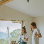 Room Renovation - A Happy Couple Dancing With Their Dog