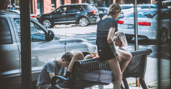 Neighborhood - Woman Siting on Bench Near on Man