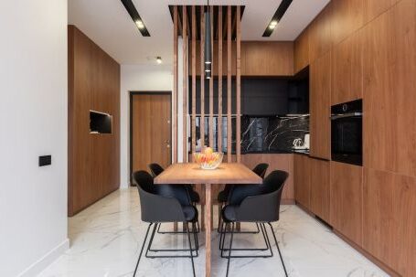 Luxury Properties - Stylish kitchen with wooden furniture and dining zone