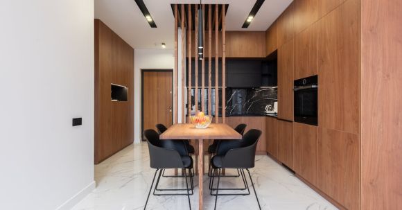 Luxury Properties - Stylish kitchen with wooden furniture and dining zone