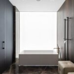 Luxury Properties - Spacious bathroom interior design with leather poufs