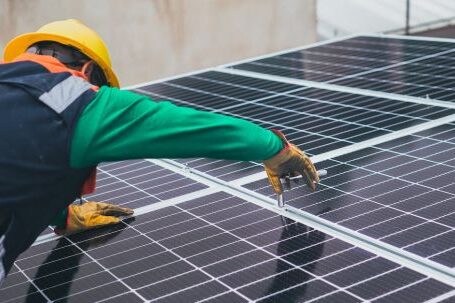 Innovative Sustainability - Solar Technician Installing Solar Panel