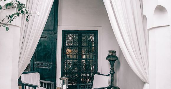 Luxury Properties - Terrace of villa with chairs around table