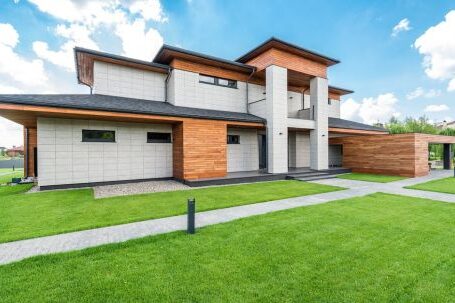 Luxury Properties - Exterior of residential house with green trees and lawn growing in countryside in summertime