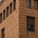 Modernist Architecture - A building with windows and a clock on it