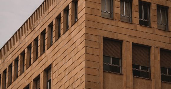 Modernist Architecture - A building with windows and a clock on it