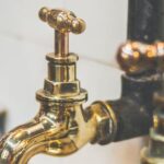 Plumbing - Close Up Photo of Golden Faucets