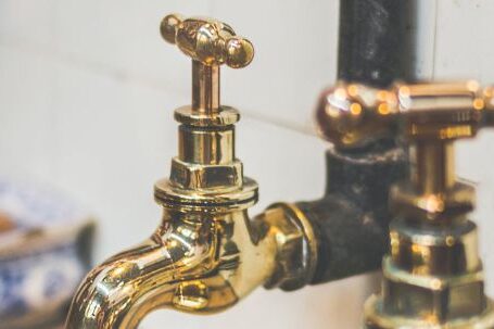 Plumbing - Close Up Photo of Golden Faucets