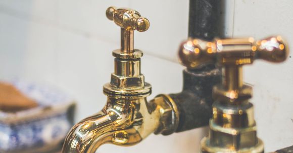 Plumbing - Close Up Photo of Golden Faucets