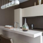 Luxury Properties - Stylish interior of contemporary spacious kitchen zone with light furniture in contemporary flat