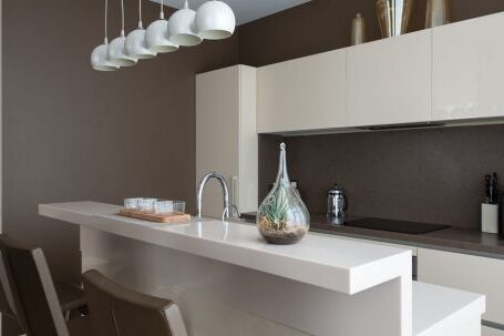 Luxury Properties - Stylish interior of contemporary spacious kitchen zone with light furniture in contemporary flat