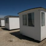 Small House - White Sheds on Gray Sands