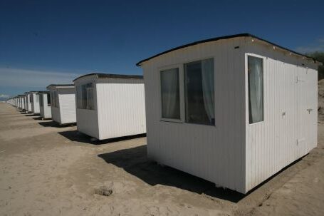 Small House - White Sheds on Gray Sands