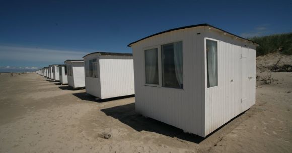 Small House - White Sheds on Gray Sands