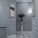 Luxury Properties - Elegant shining lamps and paintings hanging on gray walls in hallway of classic styled house with marble floor