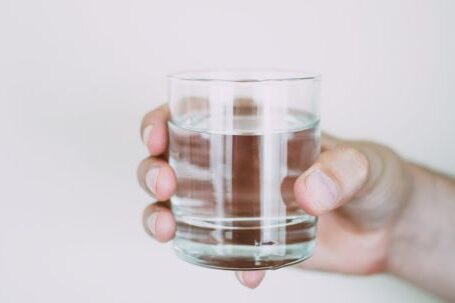 Water - Person Holding Drinking Glass