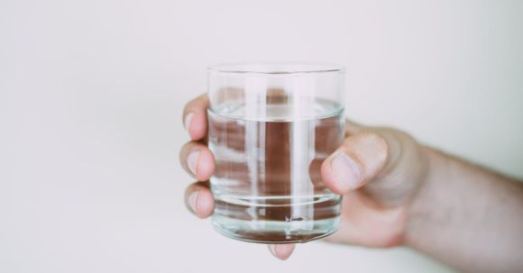 Water - Person Holding Drinking Glass
