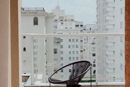 Neighborhood - Modern chair on balcony of modern building