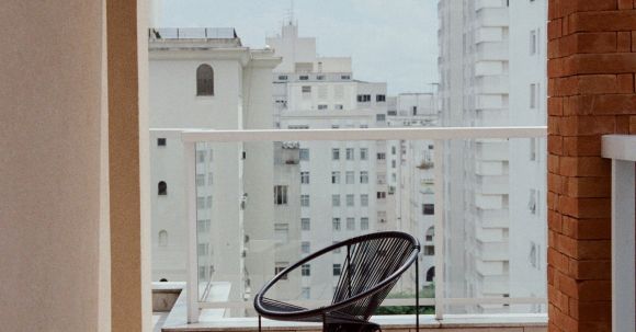 Neighborhood - Modern chair on balcony of modern building