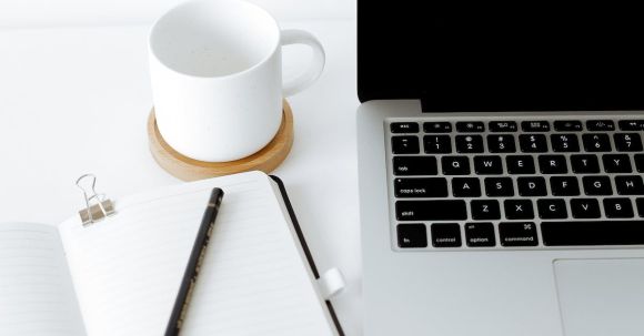 Smart Homes - Workplace with laptop and opened diary