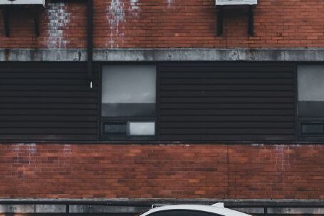 Contemporary Architecture - White Toyota 86 Sports Car Parked in a Residential Building Yard