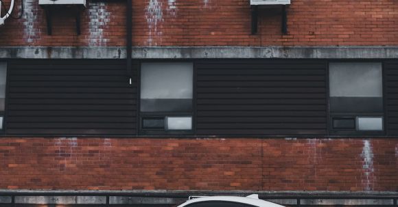 Contemporary Architecture - White Toyota 86 Sports Car Parked in a Residential Building Yard