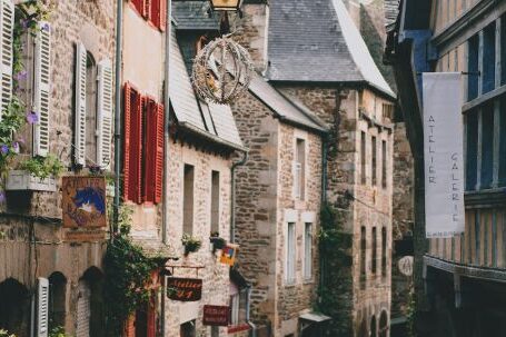 Neighborhood - Narrow pedestrian street with brick residential houses in historic town district on cloudy day