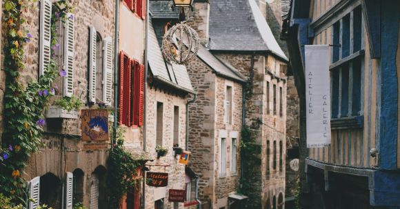 Neighborhood - Narrow pedestrian street with brick residential houses in historic town district on cloudy day