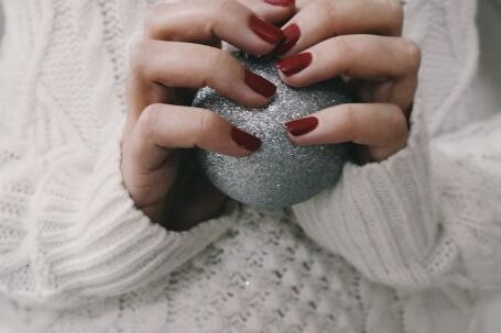 Holiday Season - Person Holding Gray Ball