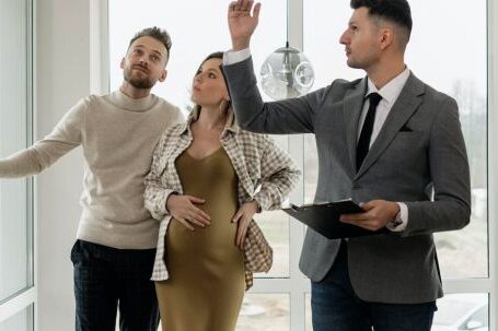 New Home - Real Estate Agent Showing Property to a Couple