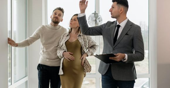 New Home - Real Estate Agent Showing Property to a Couple