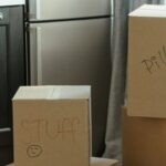 New Home - Brown Cardboard Boxes on White Wooden Cabinet