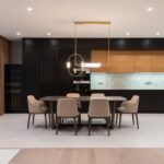 Luxury Properties - House with table with chairs near open kitchen and couch