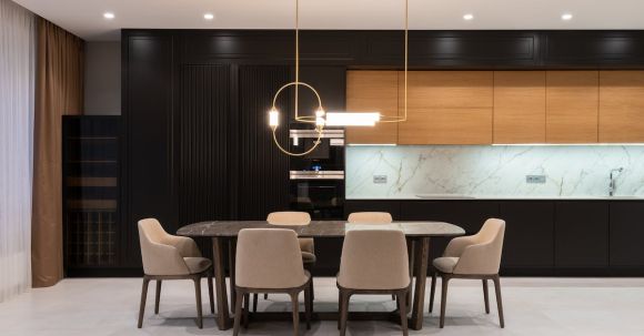 Luxury Properties - Flat with table and chairs near open kitchen