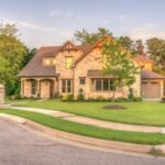 Home Exterior - Brown Brick House Beside Trees