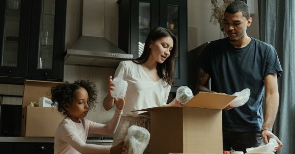 New Home - Man in Black Crew Neck Shirt Holding Girl in White Long Sleeve Shirt