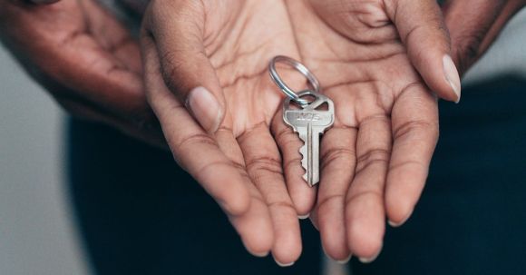 New Home - Key on a Person's Palm