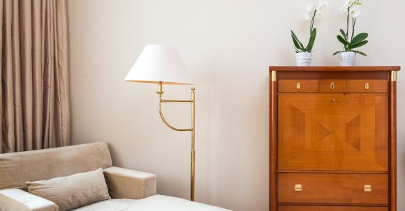 Luxury Properties - Cozy room with armchair and cabinet