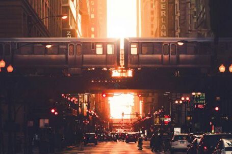 Neighborhood - Urban city district with modern high rise architecture and elevated railway in early evening