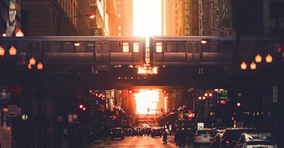 Neighborhood - Urban city district with modern high rise architecture and elevated railway in early evening